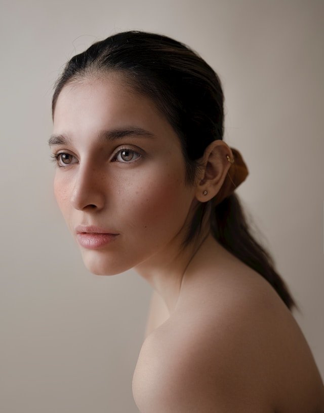 Portrait of a woman lit softly with a beauty dish