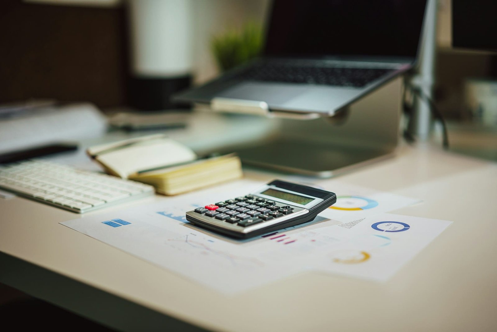 business planning calculator notebook photography
