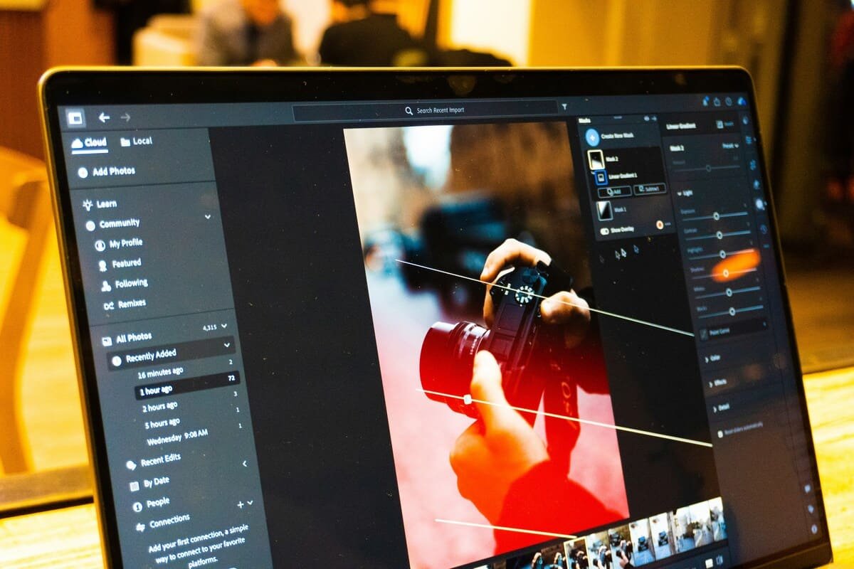 photographer editing portfolio images monitor review