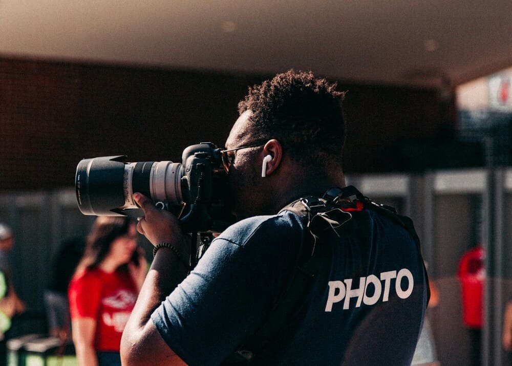 sports photographer sideline low angle shooting