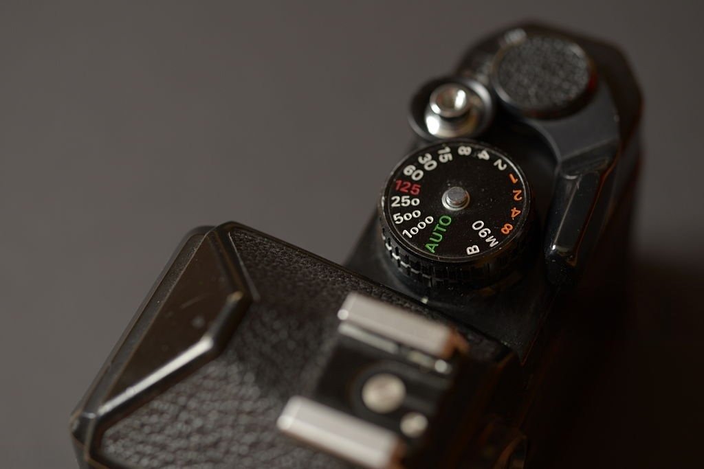 Close-up of the ISO dial on top of a camera