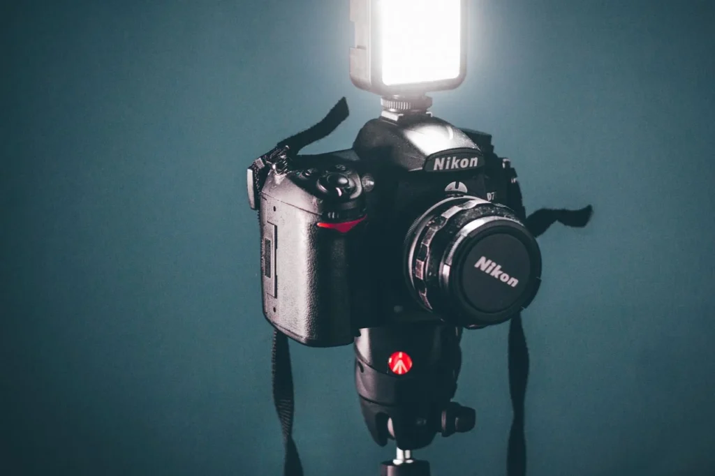 DSLR camera with a speedlight flash mounted on top