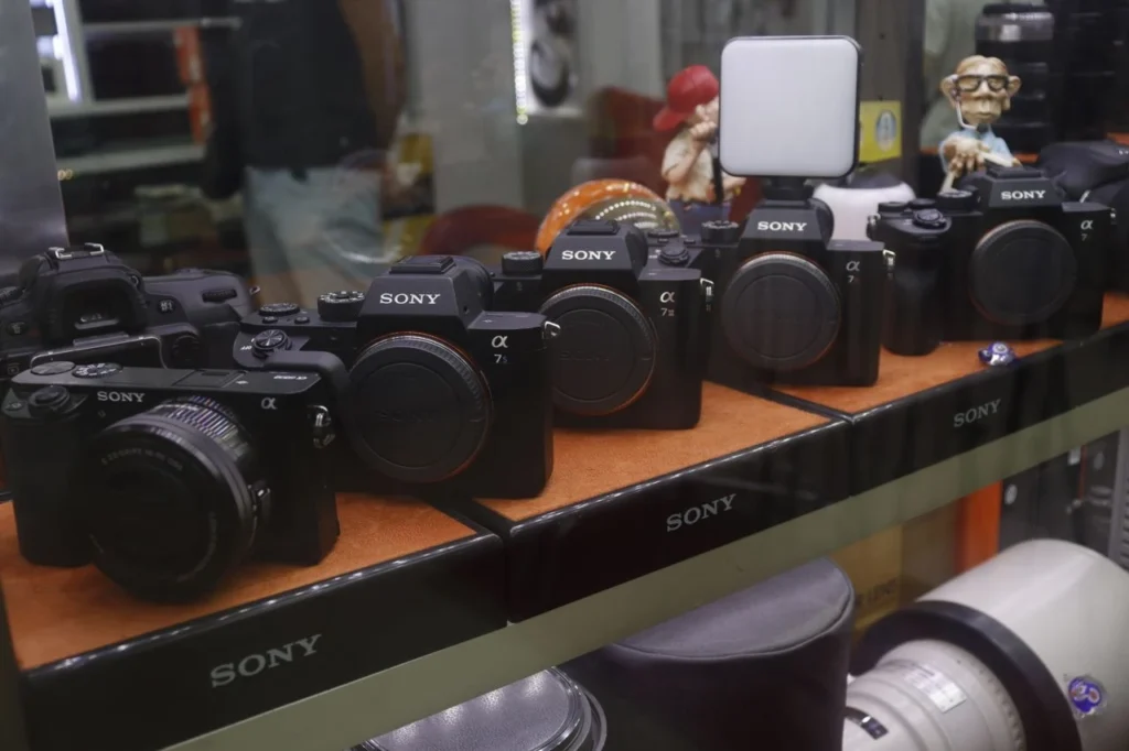 Row of Sony cameras on display in a store