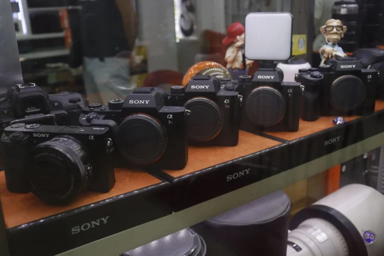 Row of Sony cameras on display in a store